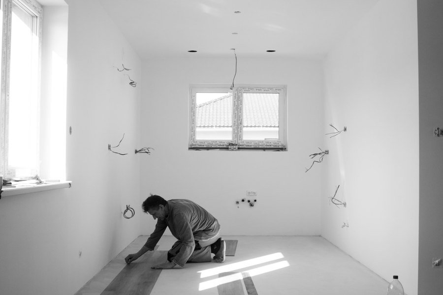Wood flooring being laid plank by plank