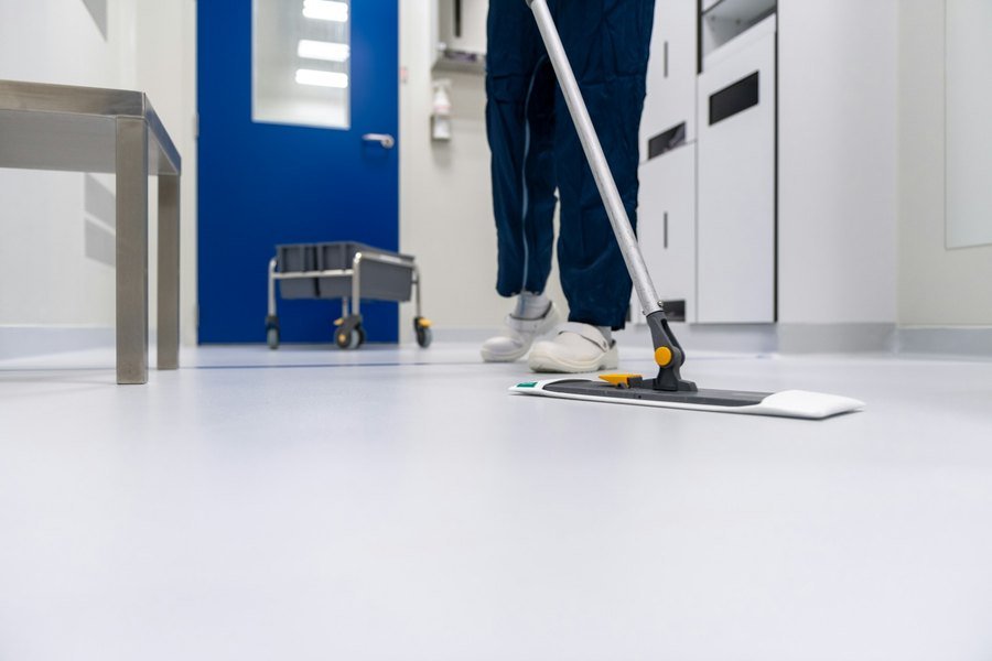 Common-area floor being mopped during a scheduled clean